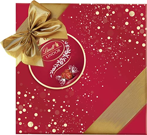 Lindt Schokolade LINDOR Präsent im Geschenkpapier l 375 g l Milch-Schokoladen-Kugeln mit unendlich zartschmelzender Füllung l Schokoladengeschenk l Pralinengeschenk